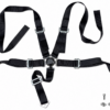 REACTOR five-point harness – overview Black five-point sim racing harness with central buckle and mounting hardware