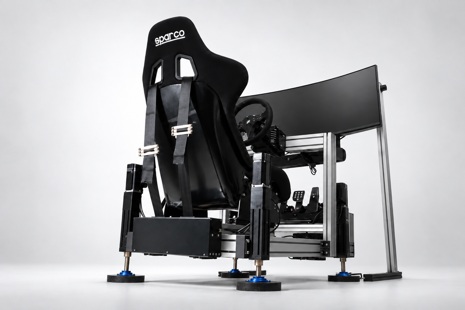 Sim racing rig with REACTOR Motion actuators, racing seat and curved monitor